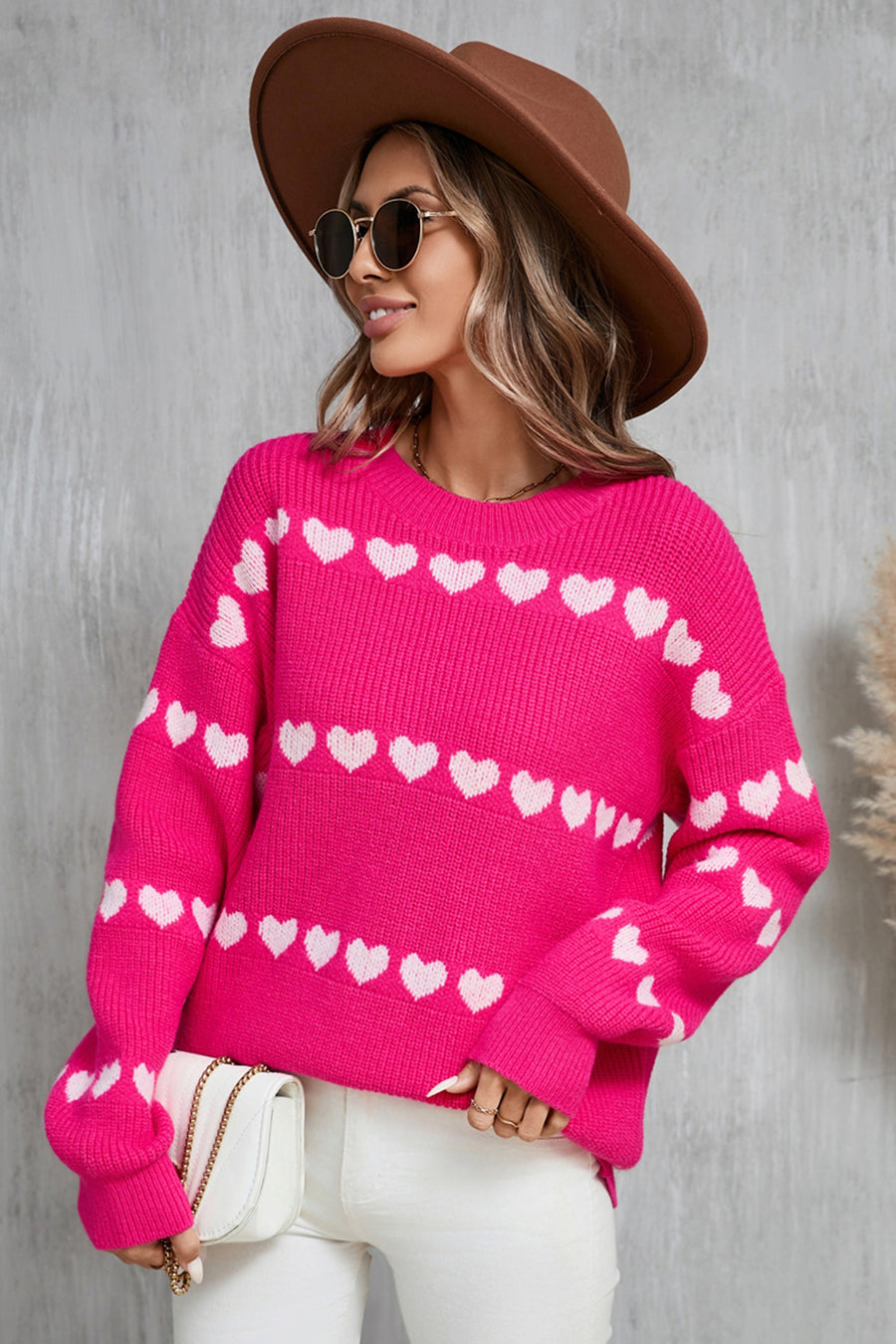 Hot Pink knit pullover sweater with white heart stripe pattern, crew neck, and long sleeves.