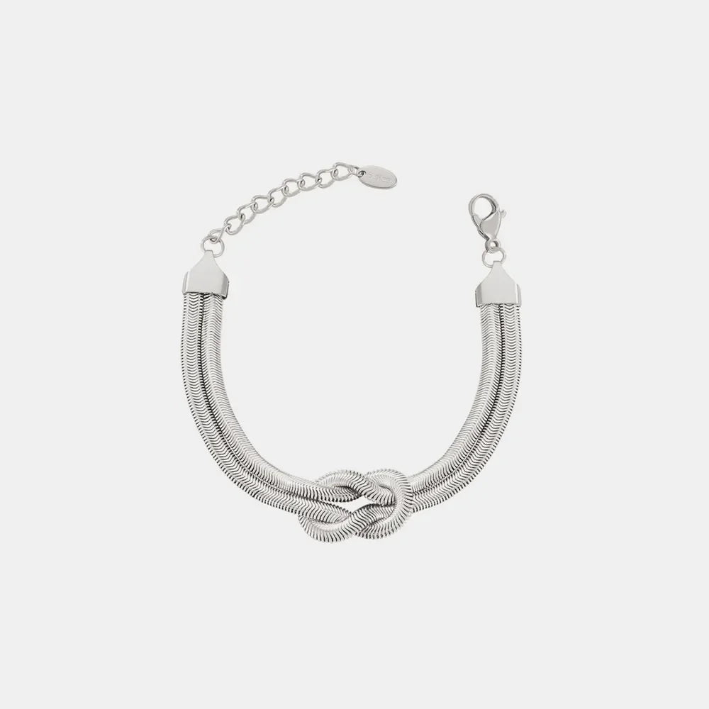 Silver snake chain bracelet with a knot detail and adjustable clasp