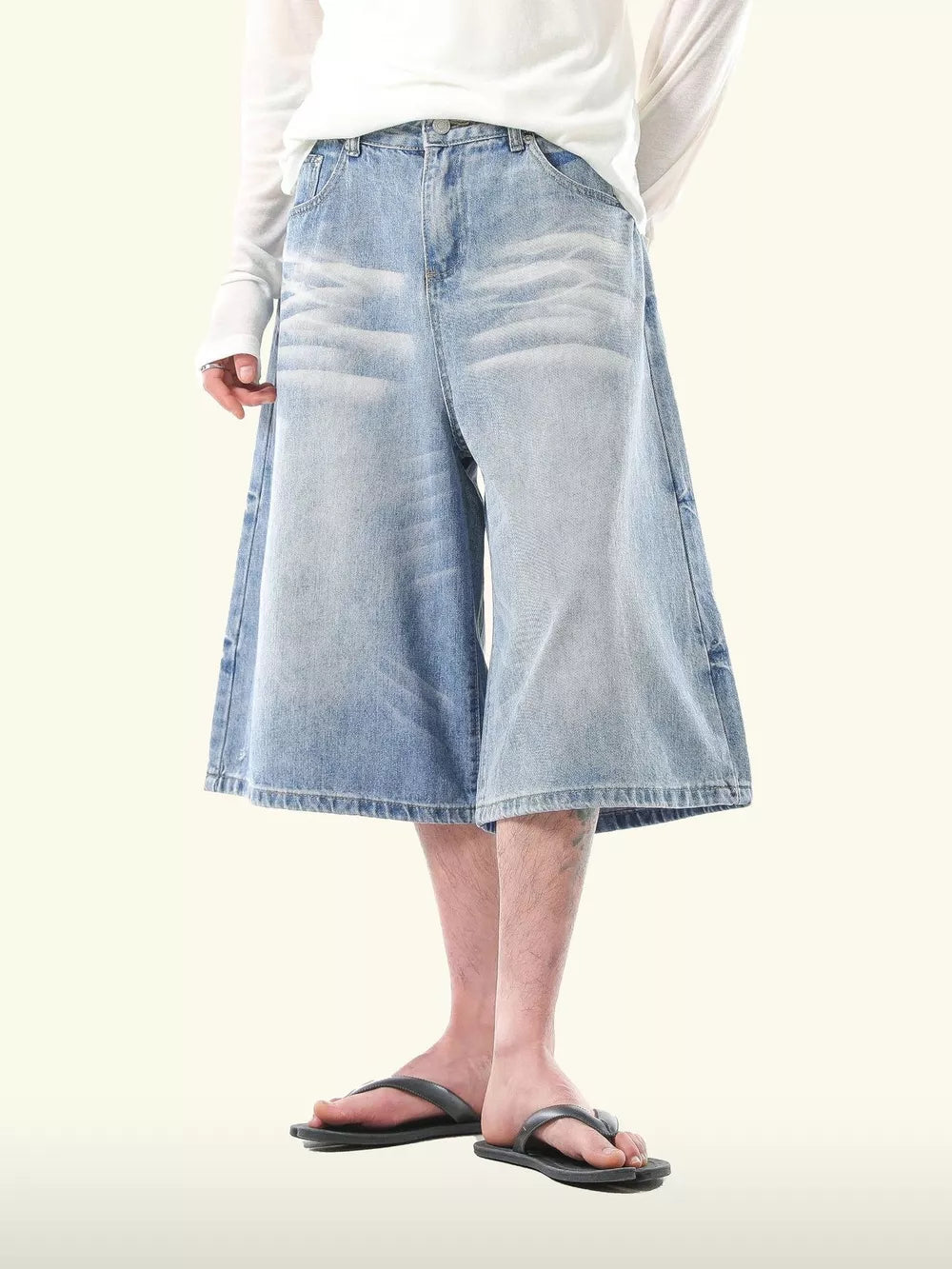 Relaxed fit light blue denim capris for men, wide leg, casual culotte style.