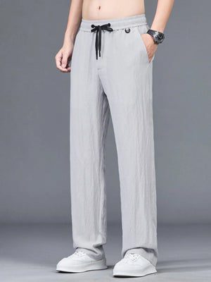 Lightweight linen-blend trousers in Linen Gray with drawstring waist and pockets.