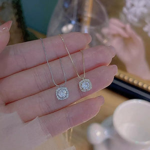Elegant zircon pendant necklaces in sterling silver, gold and silver box chains.
