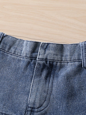 Toddler denim shorts with elastic waistband and pocket detail.