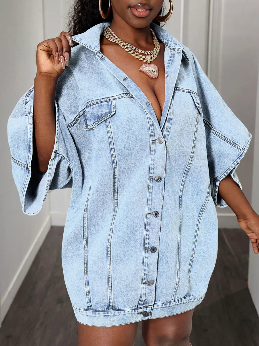 Sky blue oversized denim batwing dress with button front and wide sleeves.