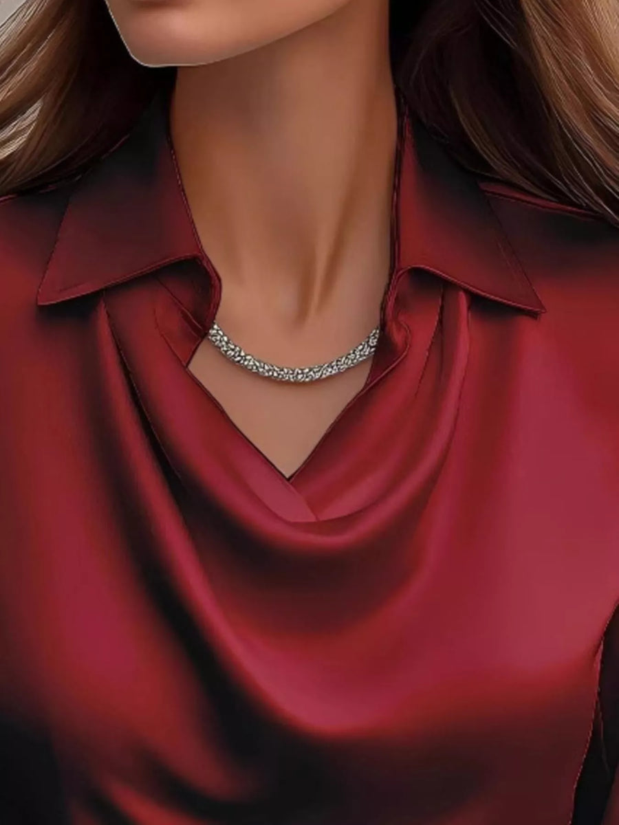 Burgundy satin cowl neck long-sleeve blouse with a collared neckline.