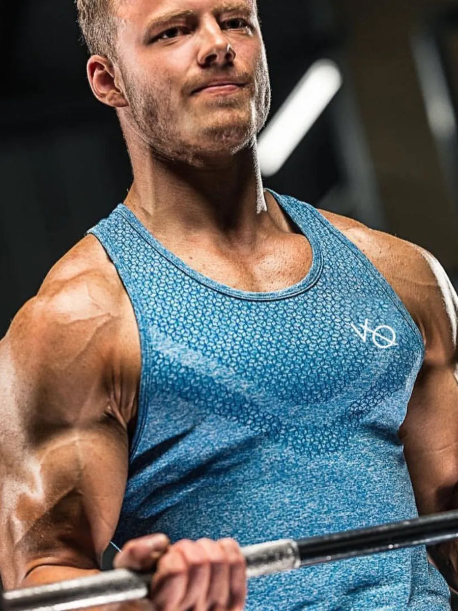 Sky blue performance knit active tank top with allover geometric pattern and crew neck.