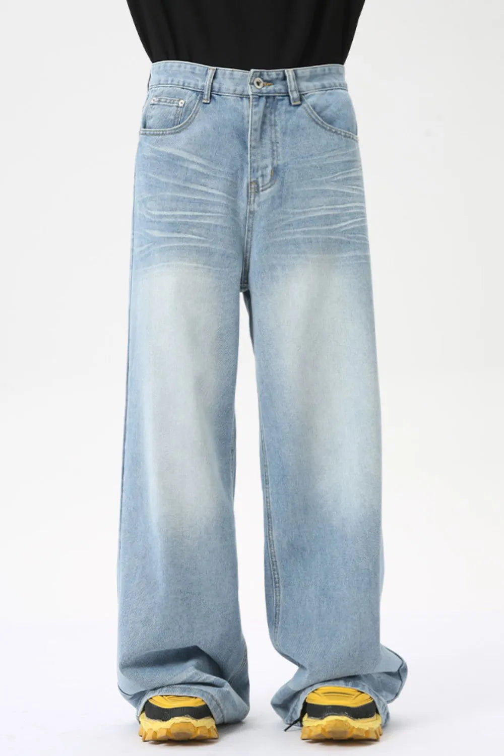 Oversized wash denim palazzo trousers in medium, featuring a wide leg and light whiskering.