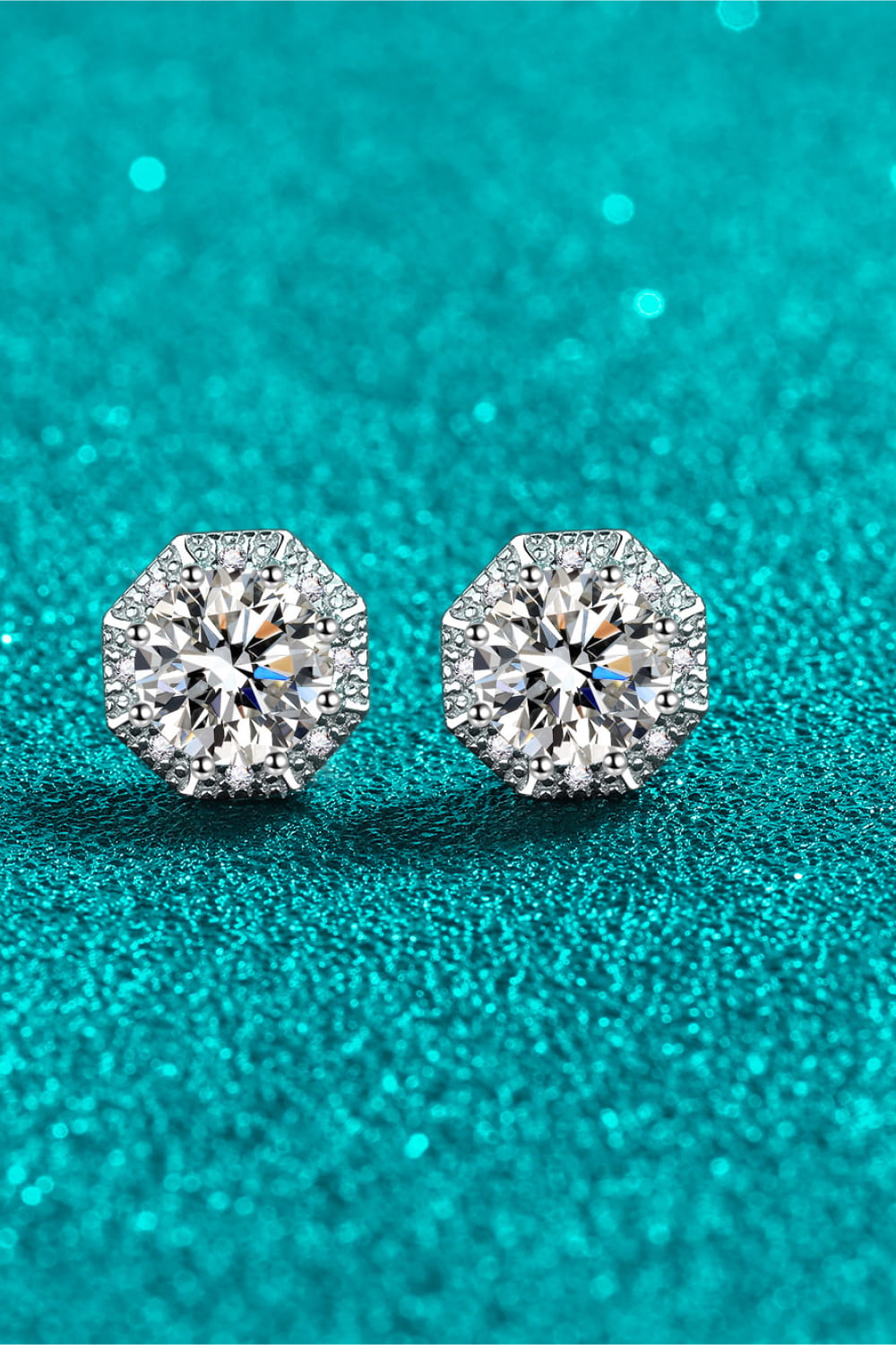 Octagonal halo moissanite stud earrings in silver with sparkling accents.