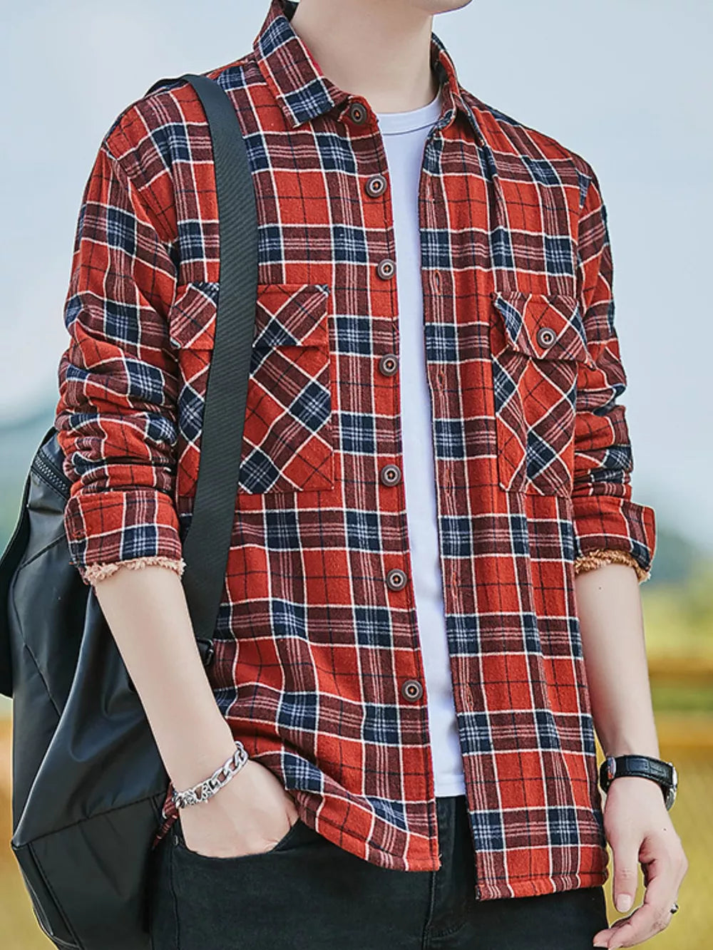 Men's red and blue plaid cotton button-up shirt with two chest pockets.