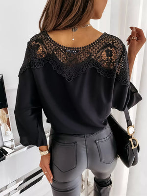Black lace-trim maternity shirt with long sleeves and a V-neckline.