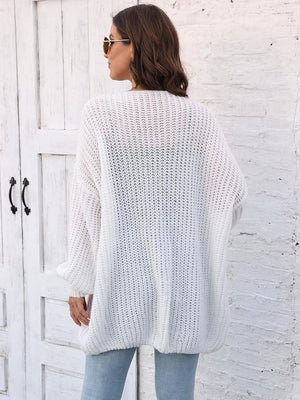 White open knit cardigan with balloon sleeves and a relaxed fit.