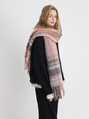 Textured plaid fringe wrap scarf in pink, white, and gray with fringed edges.