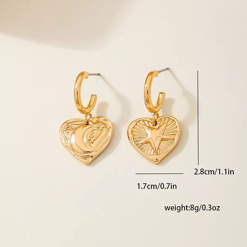 earrings in Golden with geometric and heart-shaped