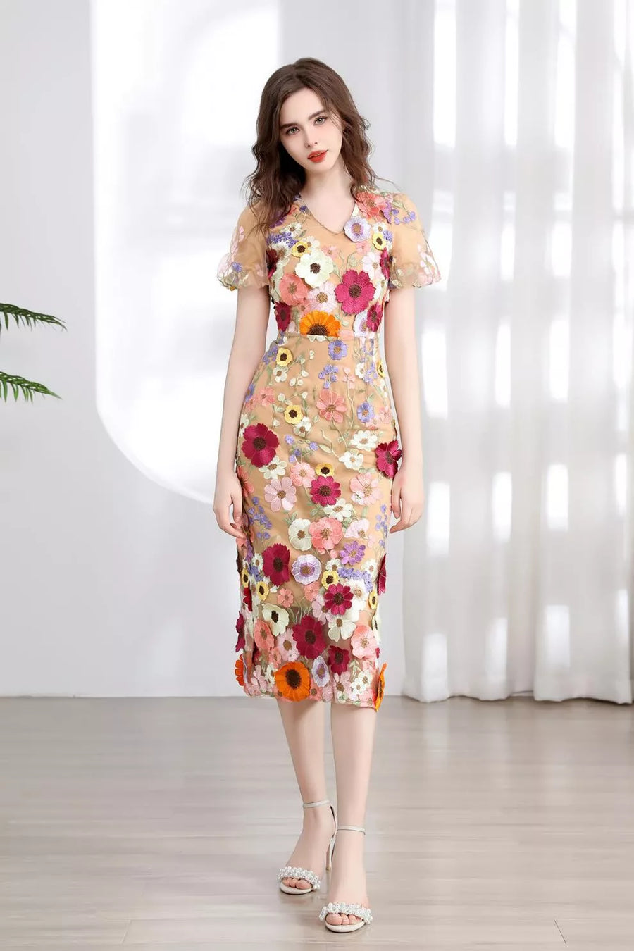 Sheer floral embroidered midi dress with V-neck and short sleeves.
