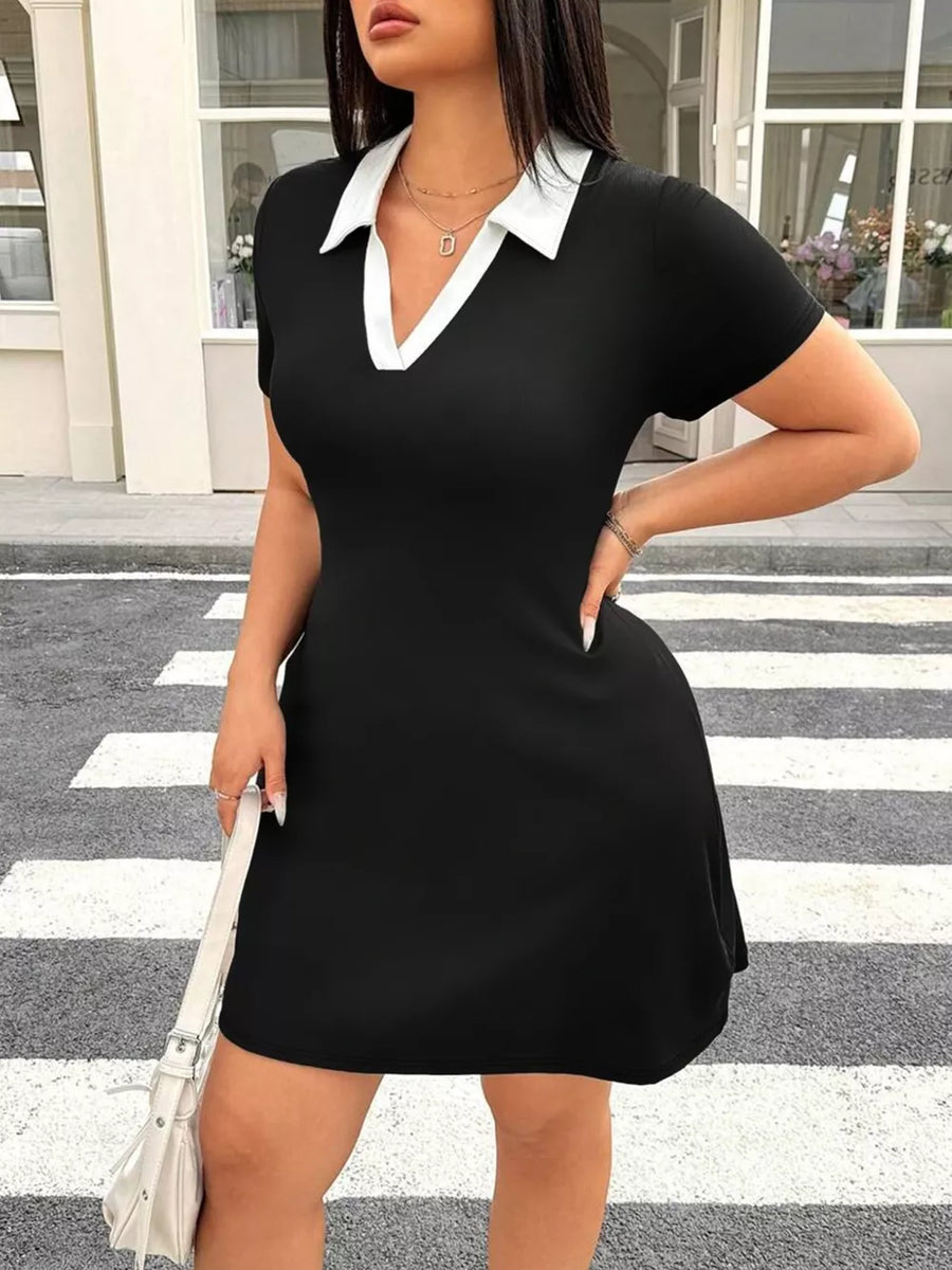 Black bodycon mini dress with short sleeves and a white contrast collar.