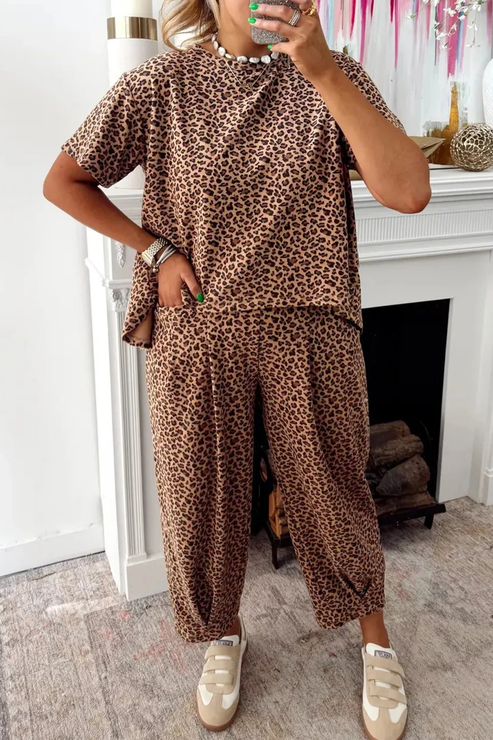 Print relaxed fit two-piece set with short sleeves and cropped pants in animal print.