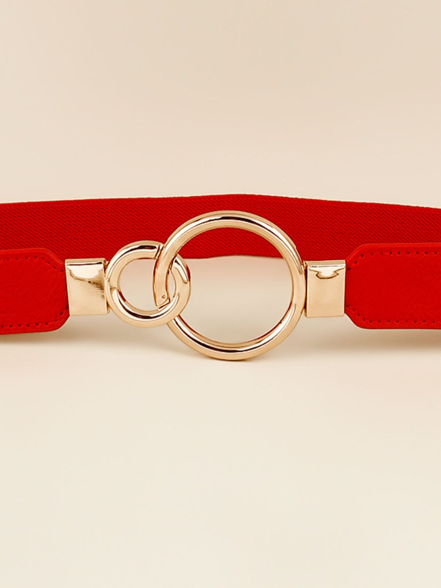 Red elastic belt with gold interlocked rings and buckle detail