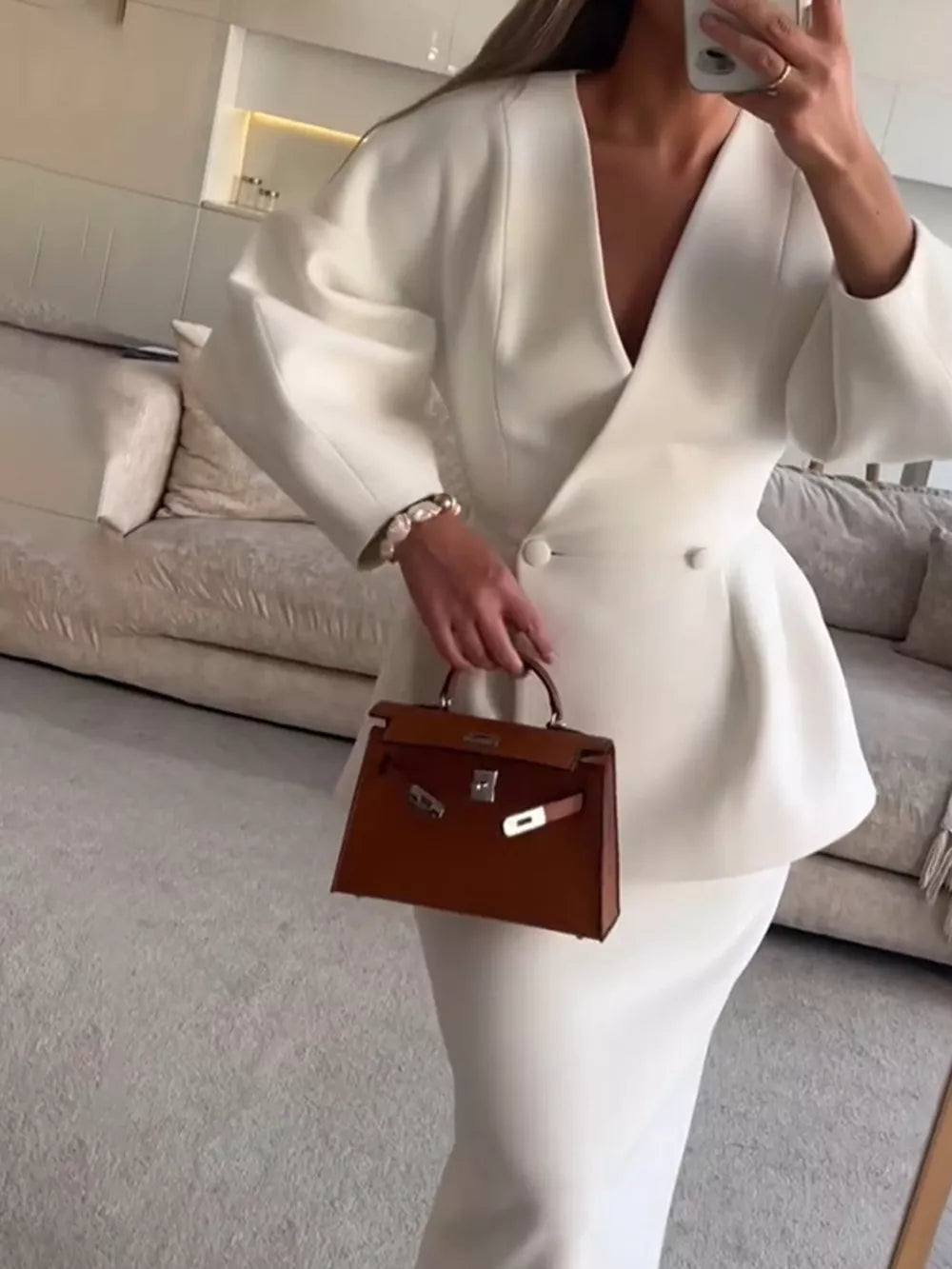 100% polyester Care instructions: Machine wash cold blazer in ivory with fitted silhouette