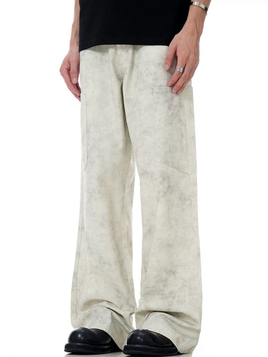 Men's wide-leg pants in marble wheat with a washed pattern and cargo pockets.