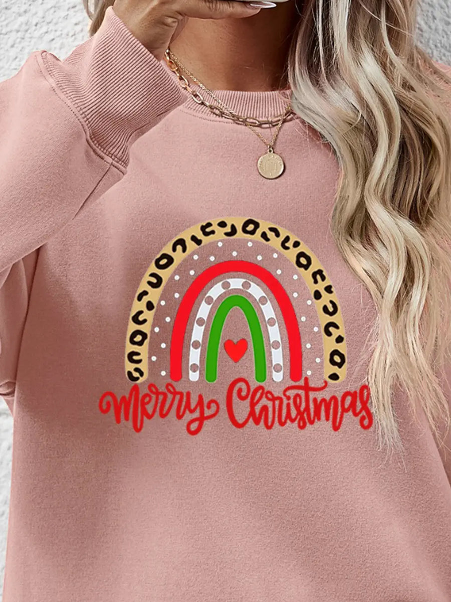 Blush pink sweatshirt with rainbow graphic and Merry Christmas text.