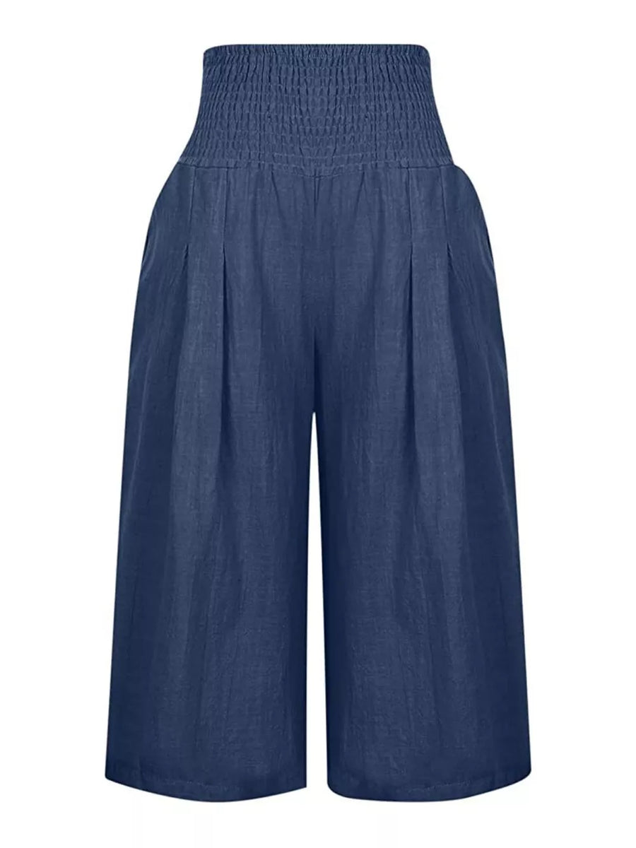 Navy blue wide-leg culottes with smocked high waist and pleated front