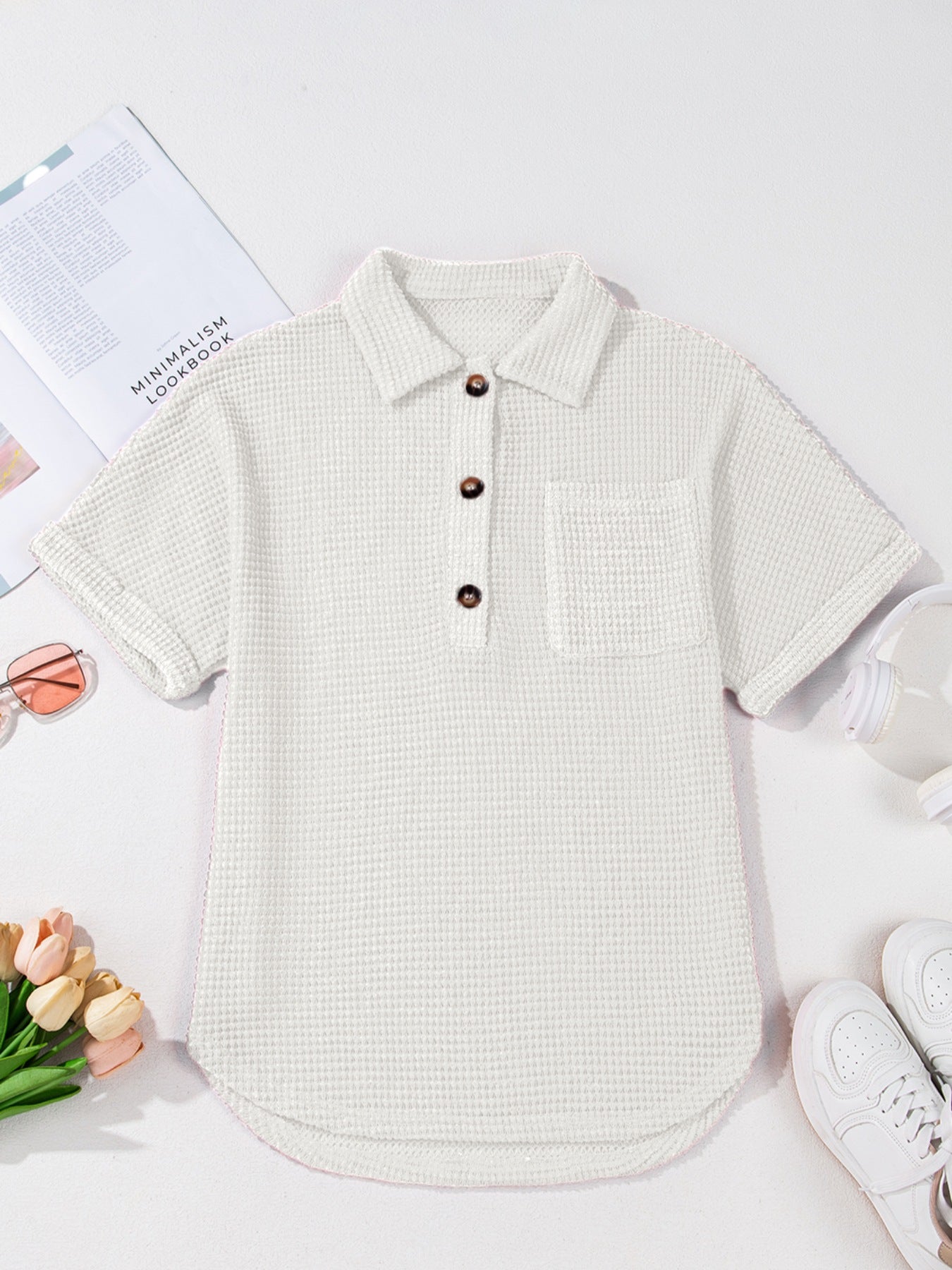 White waffle knit button-up shirt with short sleeves and chest pocket