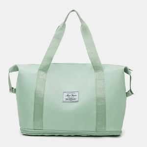 Light green nylon tote bag with dual handles and a white label.