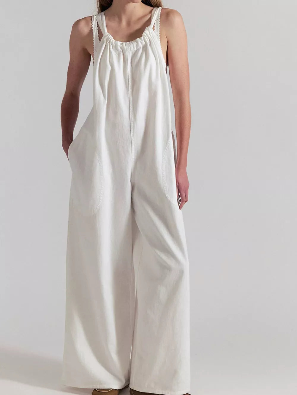 jumpsuit in white featuring pocketed and loose fit
