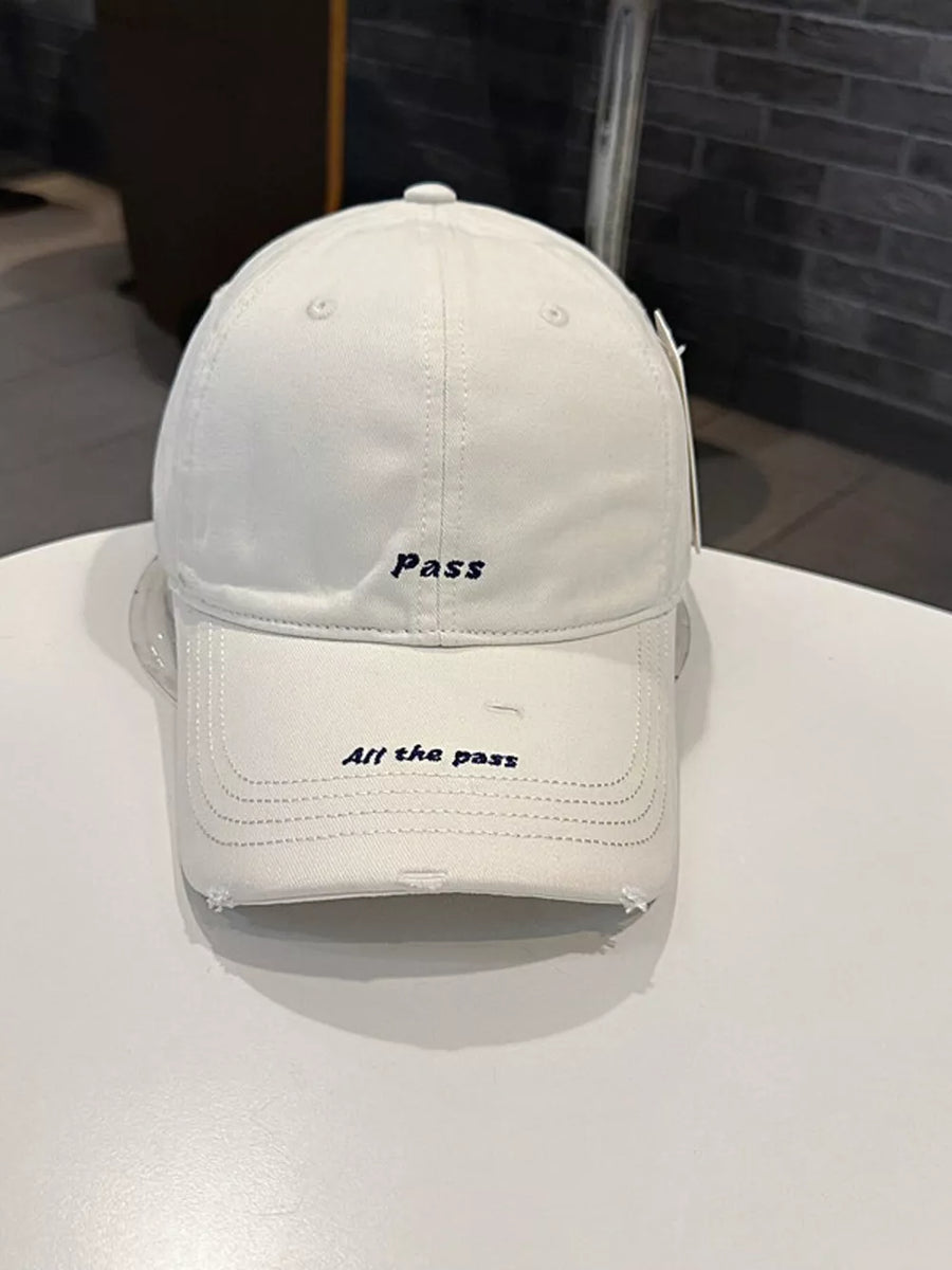 Cream white distressed baseball cap with embroidered "pass" and "All the pass" slogans.