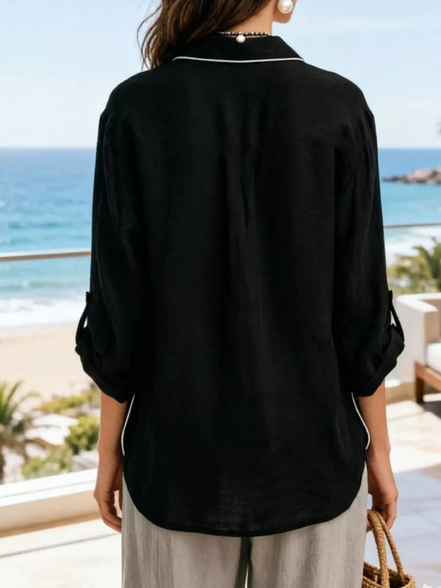 Black linen blend shirt with white piping, rolled sleeves, and a relaxed fit.