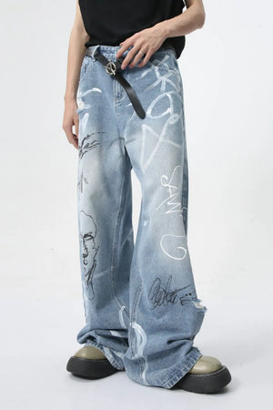Graffiti art oversized denim trousers in medium wash with distressed details and a loose fit.