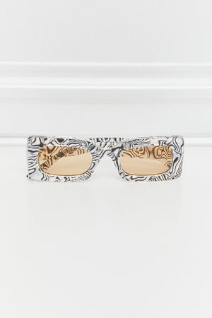 Rectangular frame sunglasses with black and white swirl print and amber lenses