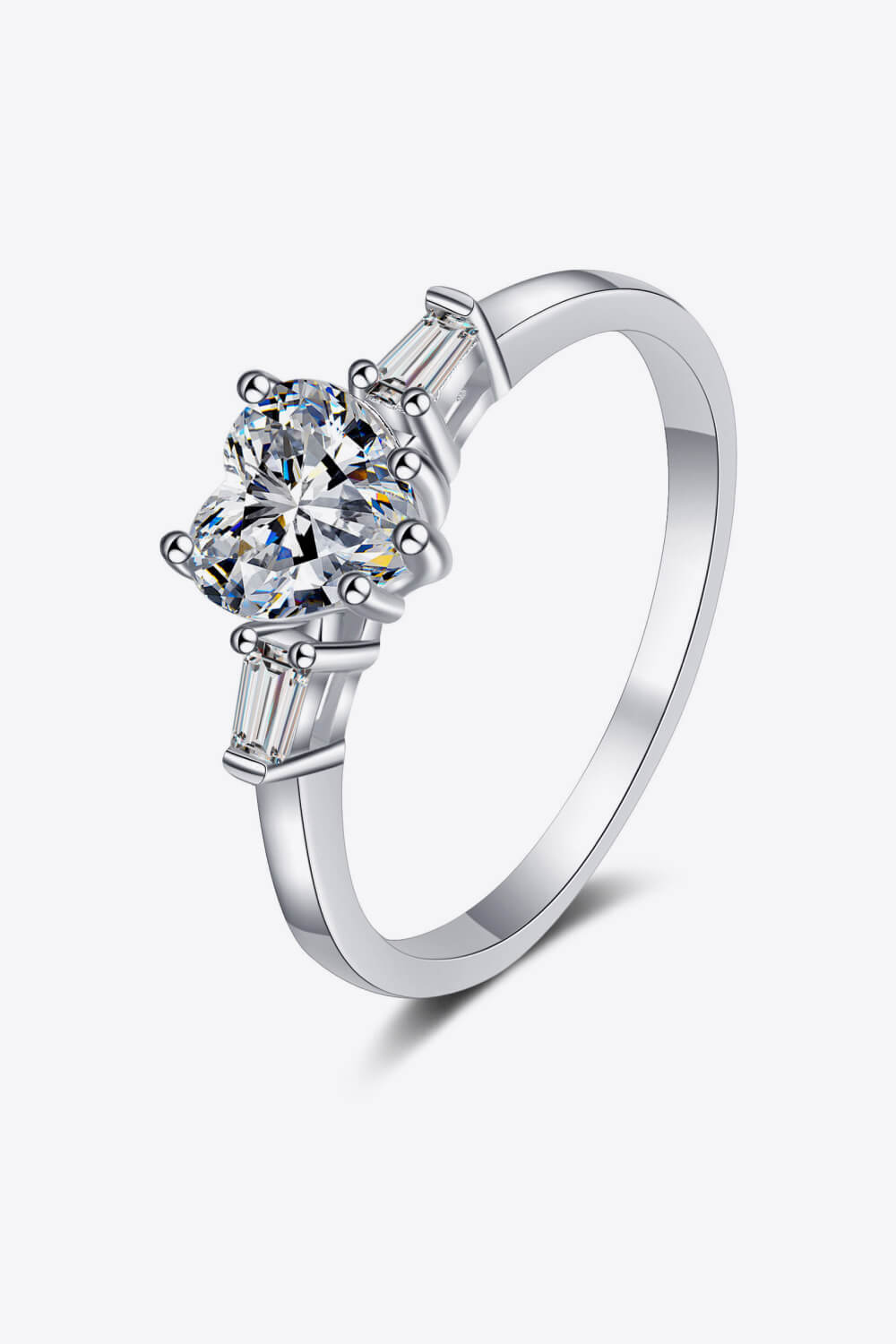 Silver ring with heart-cut moissanite and baguette stones