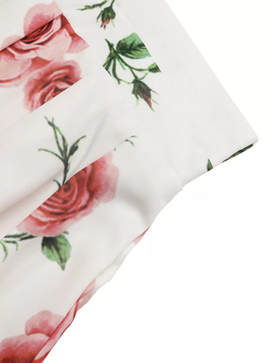 White maxi skirt with pink floral print and pleats detail