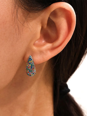Pavé teardrop stud earrings with multicolor stones on a silver base.
