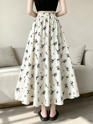 A-line skirt featuring ditsy floral in black with 100% polyester Care instructions: Machine wash cold texture