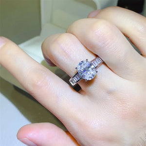 Silver oval cut engagement ring with baguette band