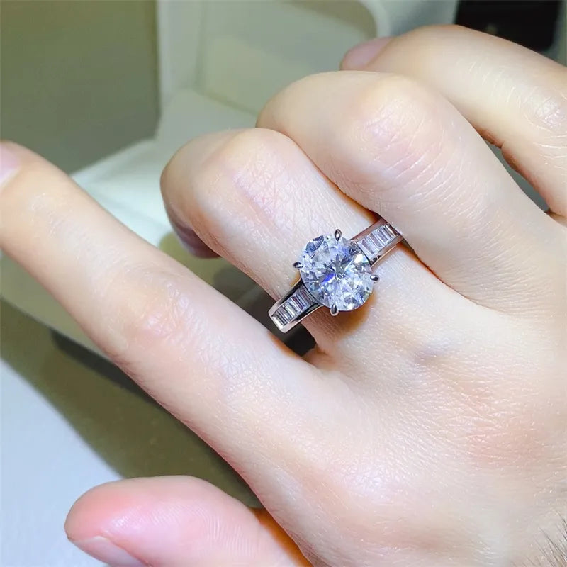 Silver oval cut engagement ring with baguette band