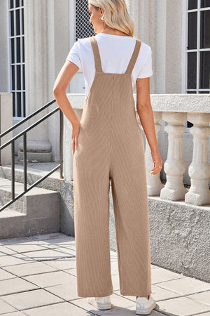 Caramel ribbed knit wide-leg overalls with patch pockets, styled with a white tee.