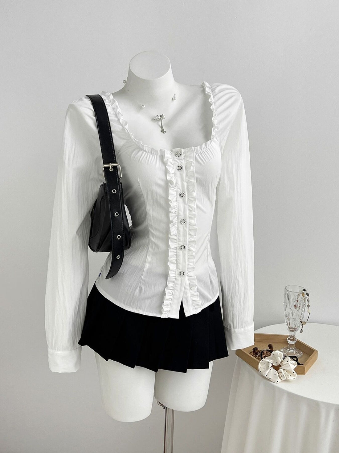 blouse in white featuring buttoned and fitted fit