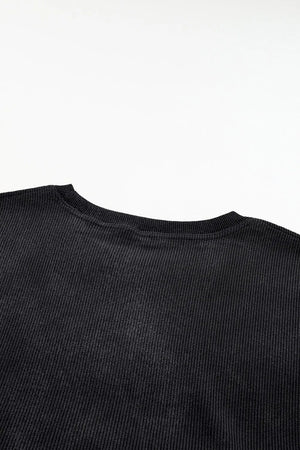 Black ribbed crewneck sweatshirt with a subtle heart outline detail.