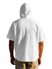 White cotton hooded shirt with short sleeves and a buttoned placket, shown from the back.