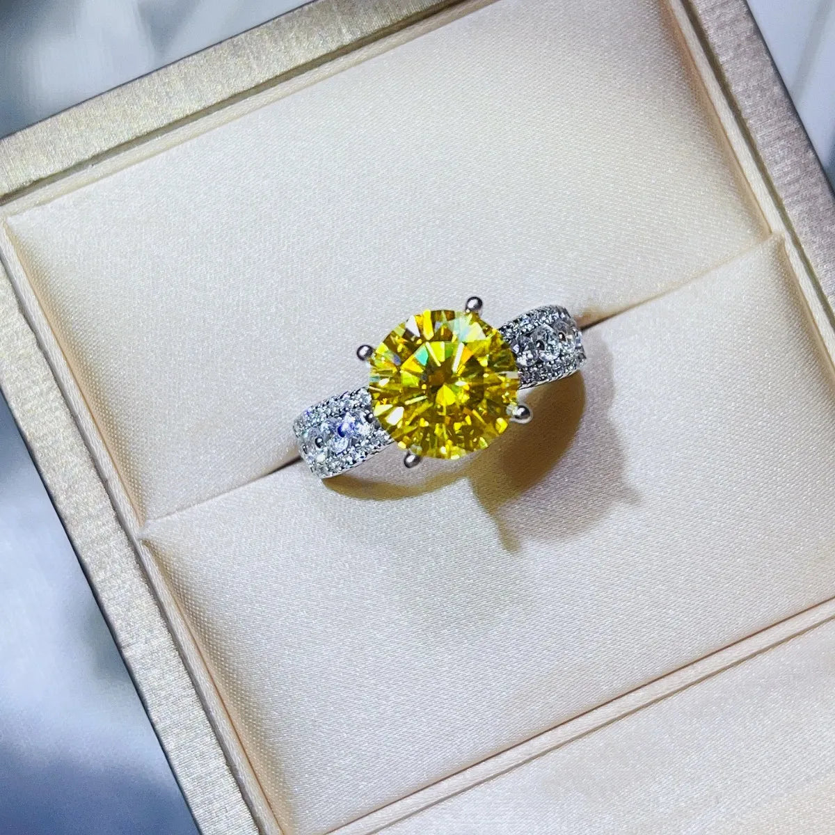 Radiant canary moissanite ring with pavé band in yellow.