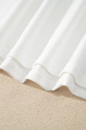 White long sleeve shirt with delicate lace trim detail and crew neckline.
