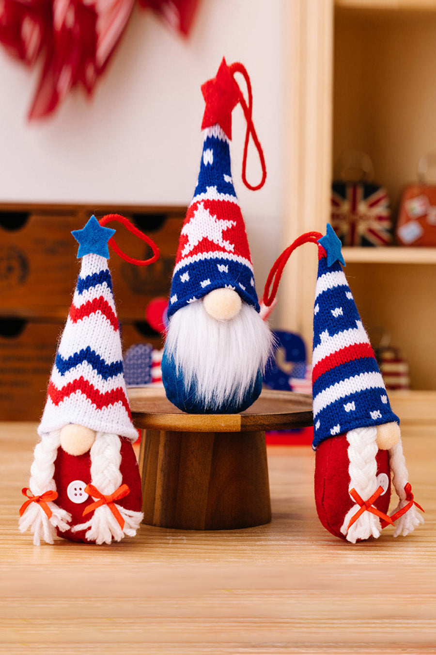Patriotic knit gnome ornaments in red, white, and blue with stars and stripes.