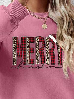 Blush Pink sweatshirt with graphic Merry Christmas text in buffalo plaid and leopard print.