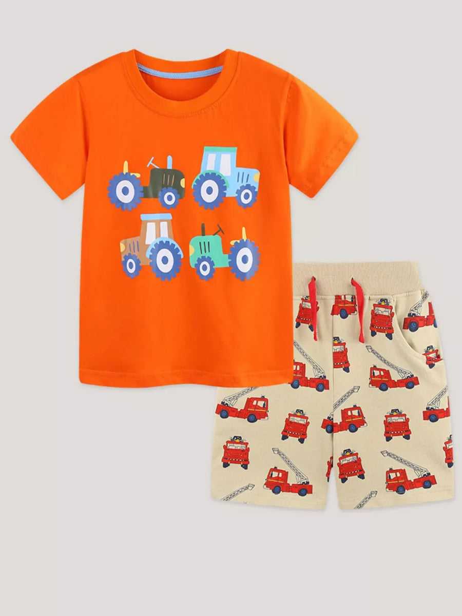 Orange cotton t-shirt with tractors and beige shorts with firetrucks.