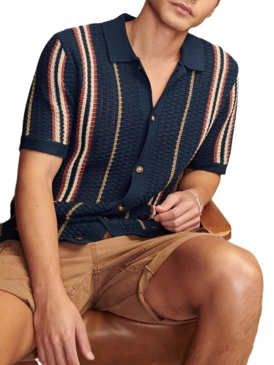 Textured stripe knit polo shirt in navy with cream and rust stripes.
