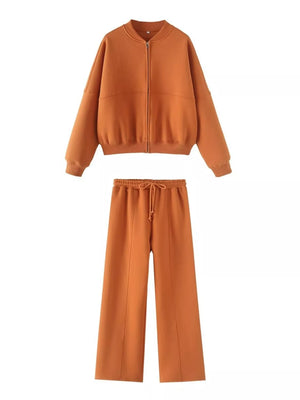 Orange zip-up bomber jacket and wide-leg drawstring pants set