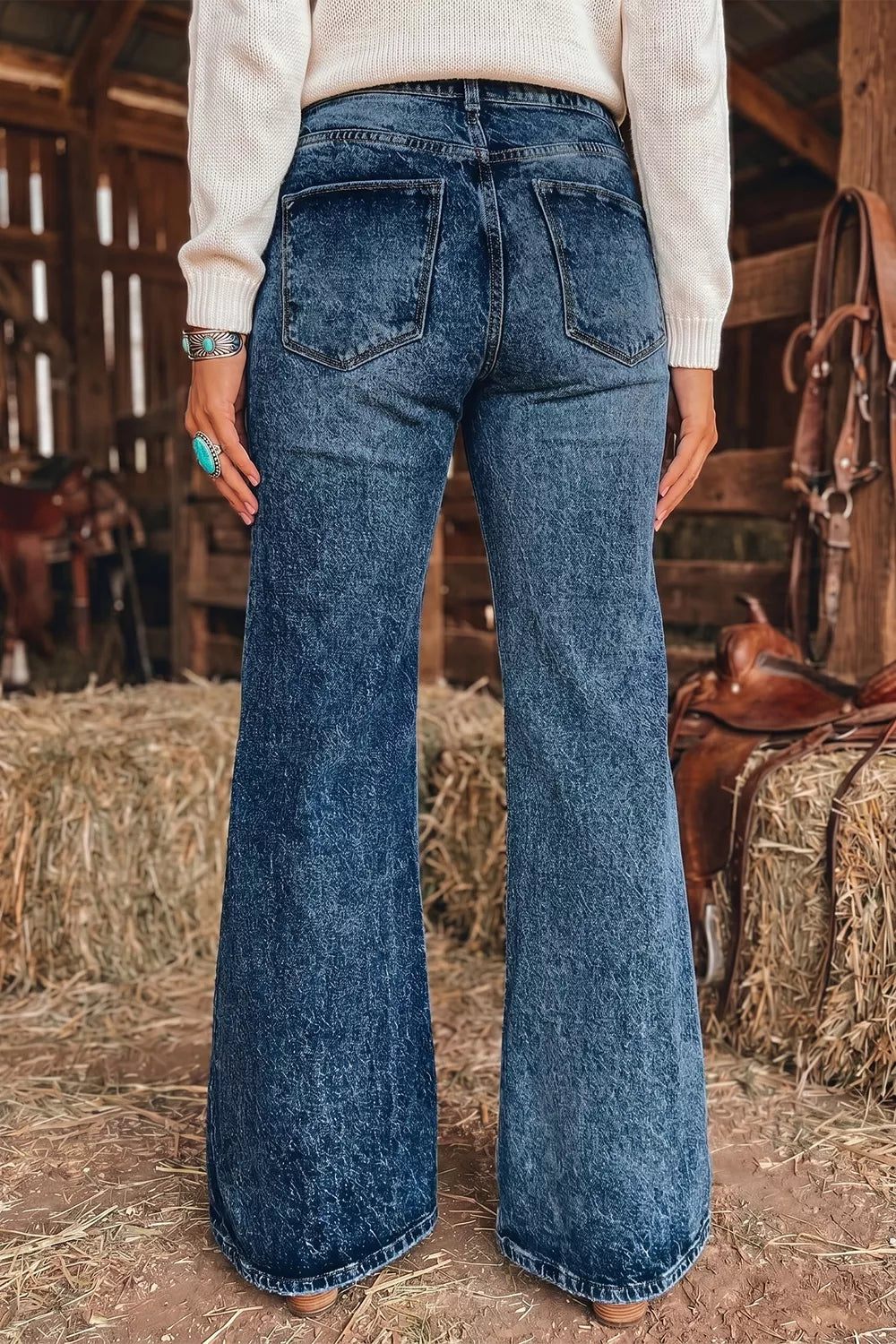 Navy flare jeans featuring buttoned and acid wash