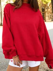 sweatshirt in red featuring exposed seam and oversized fit
